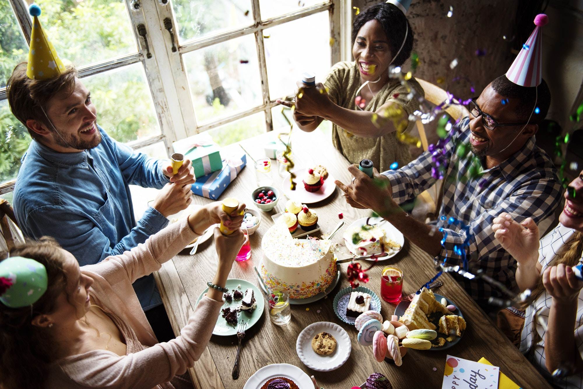 people-using-party-popping-on-friend-birthday-celebration.jpg